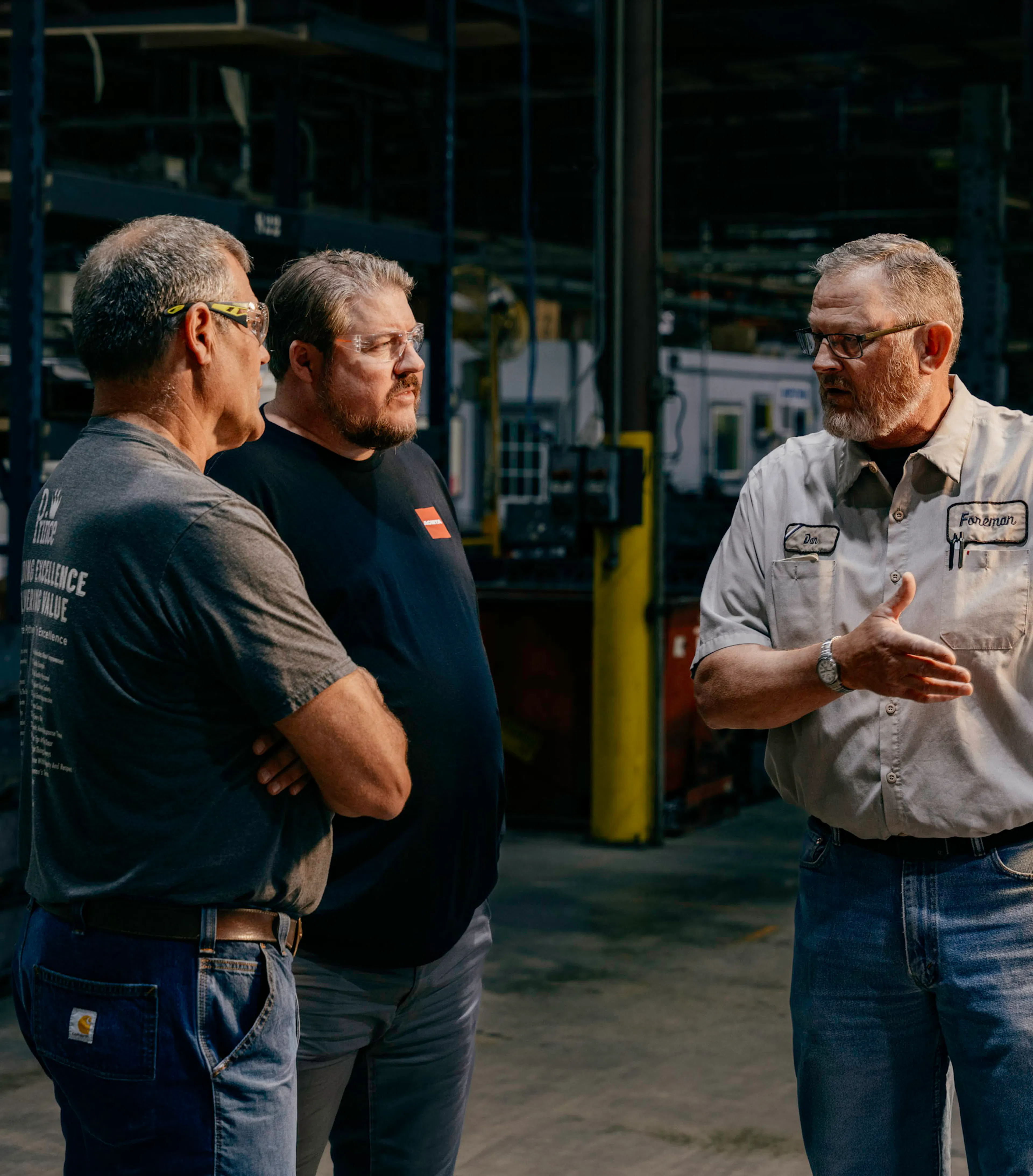 three people collaborating on industrial automation integration