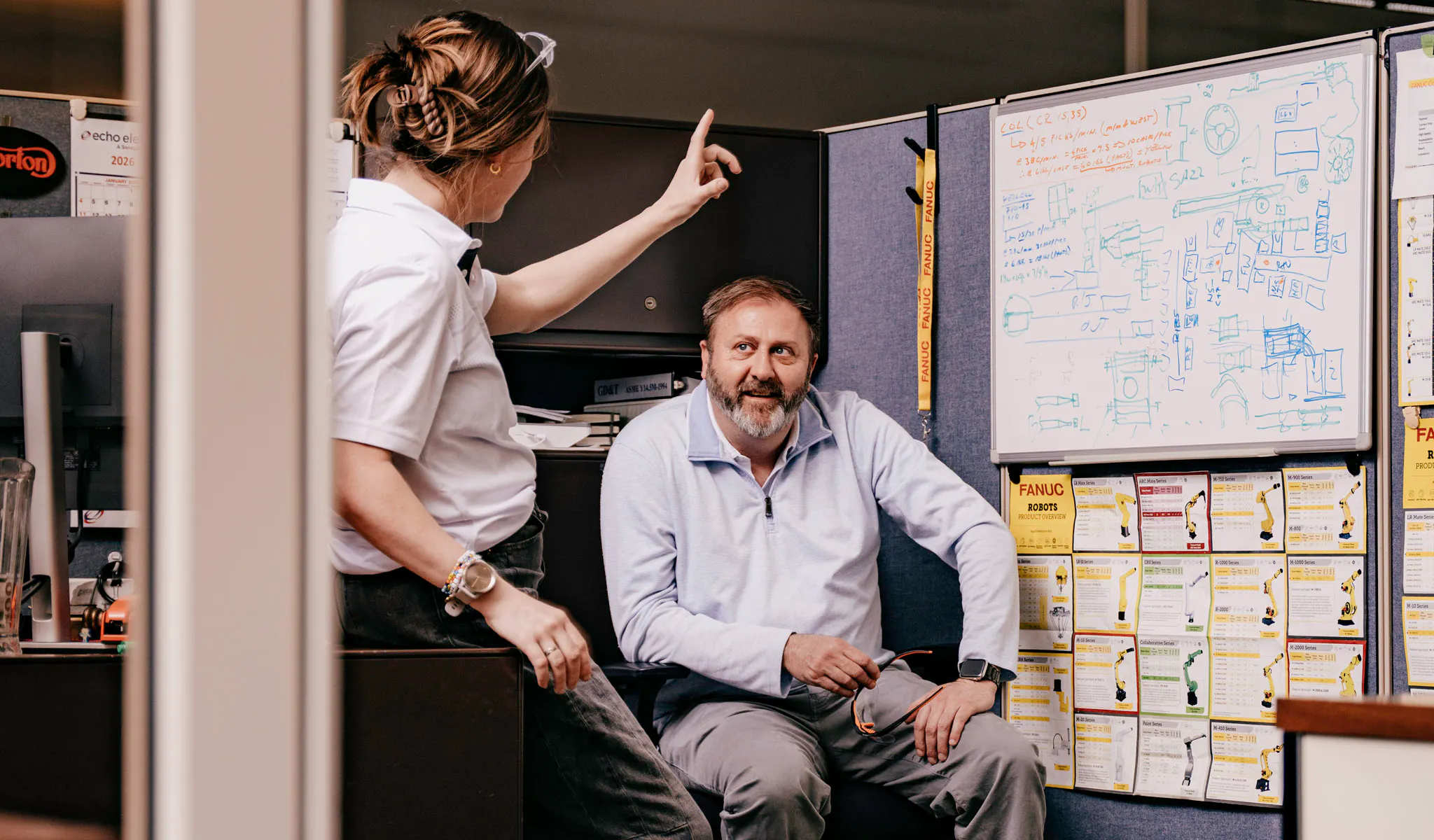 Two people collaborating on automation integration