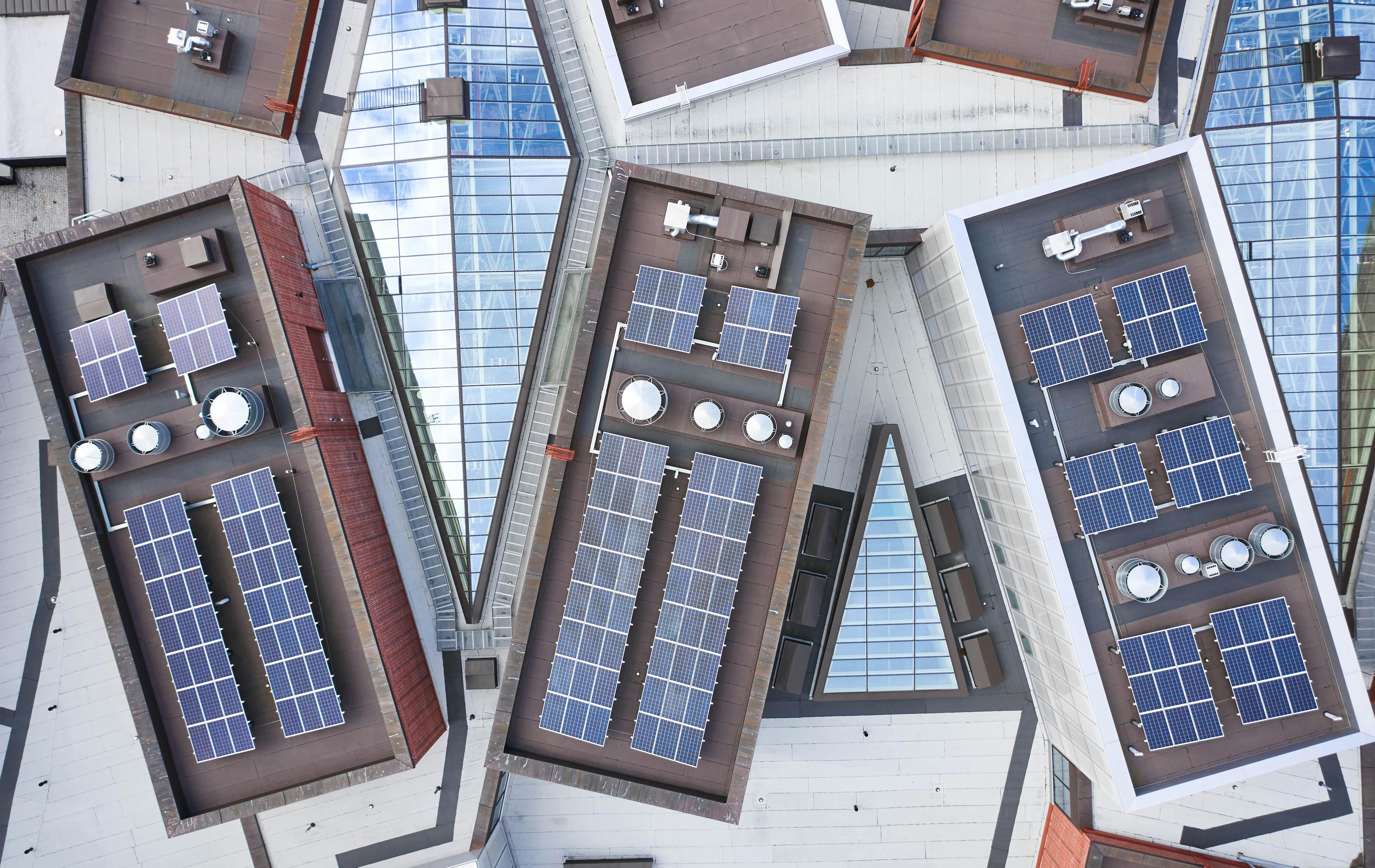 Aerial view of buildings with solar panels on roof