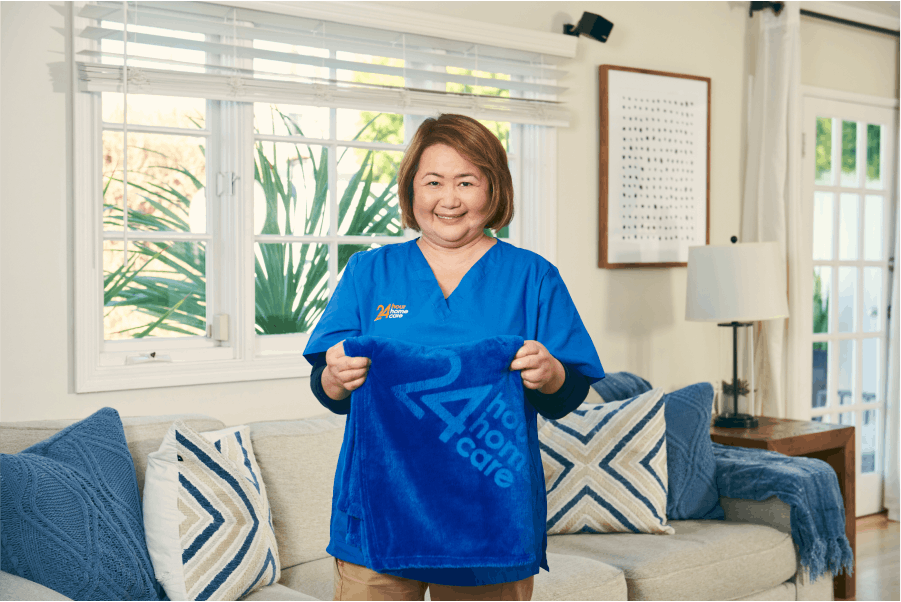 A caretaker folding a towel