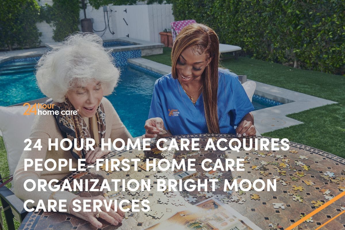 A caregiver and client put a puzzle together.