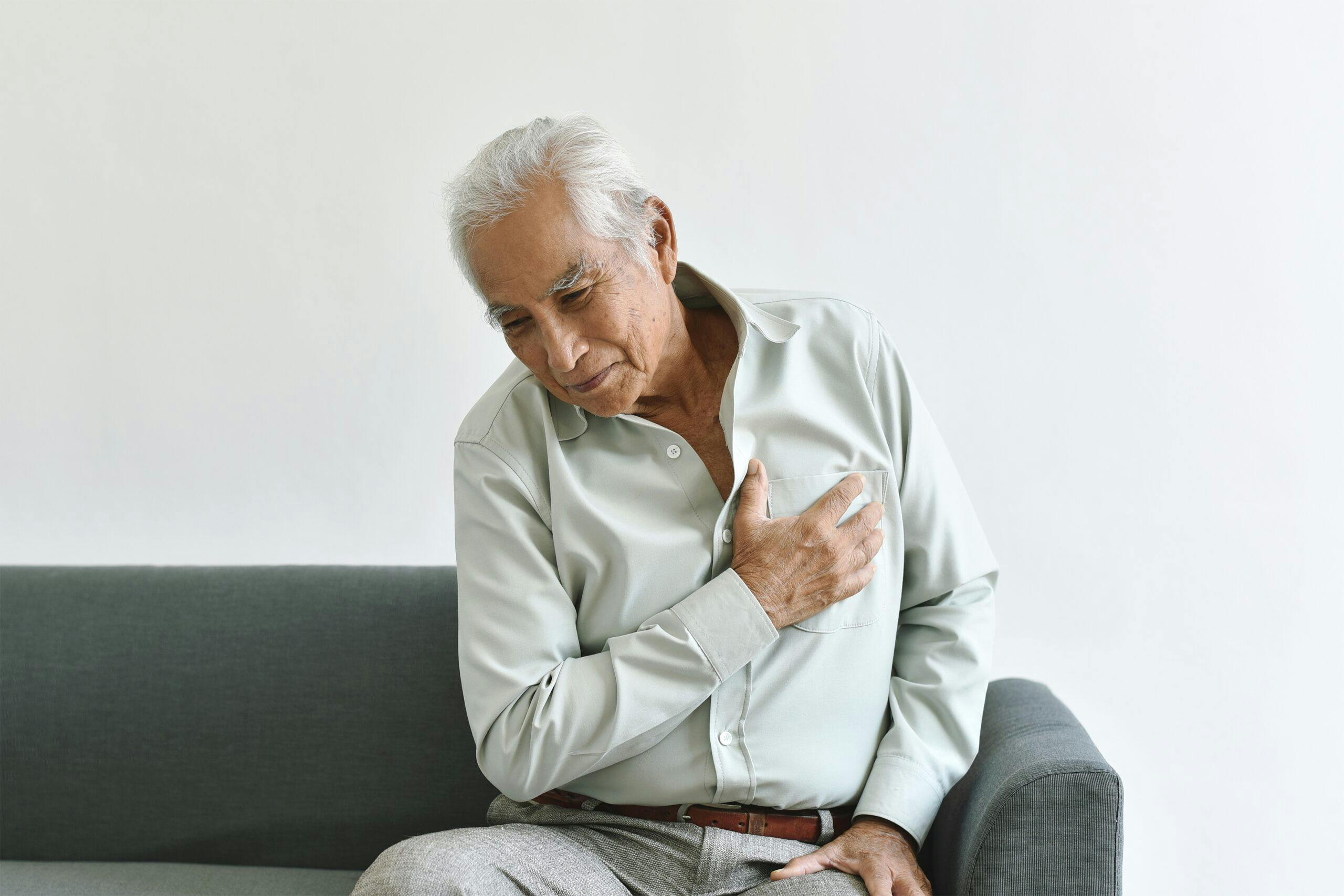 Heart attack disease problem in old man, Elderly asian man with