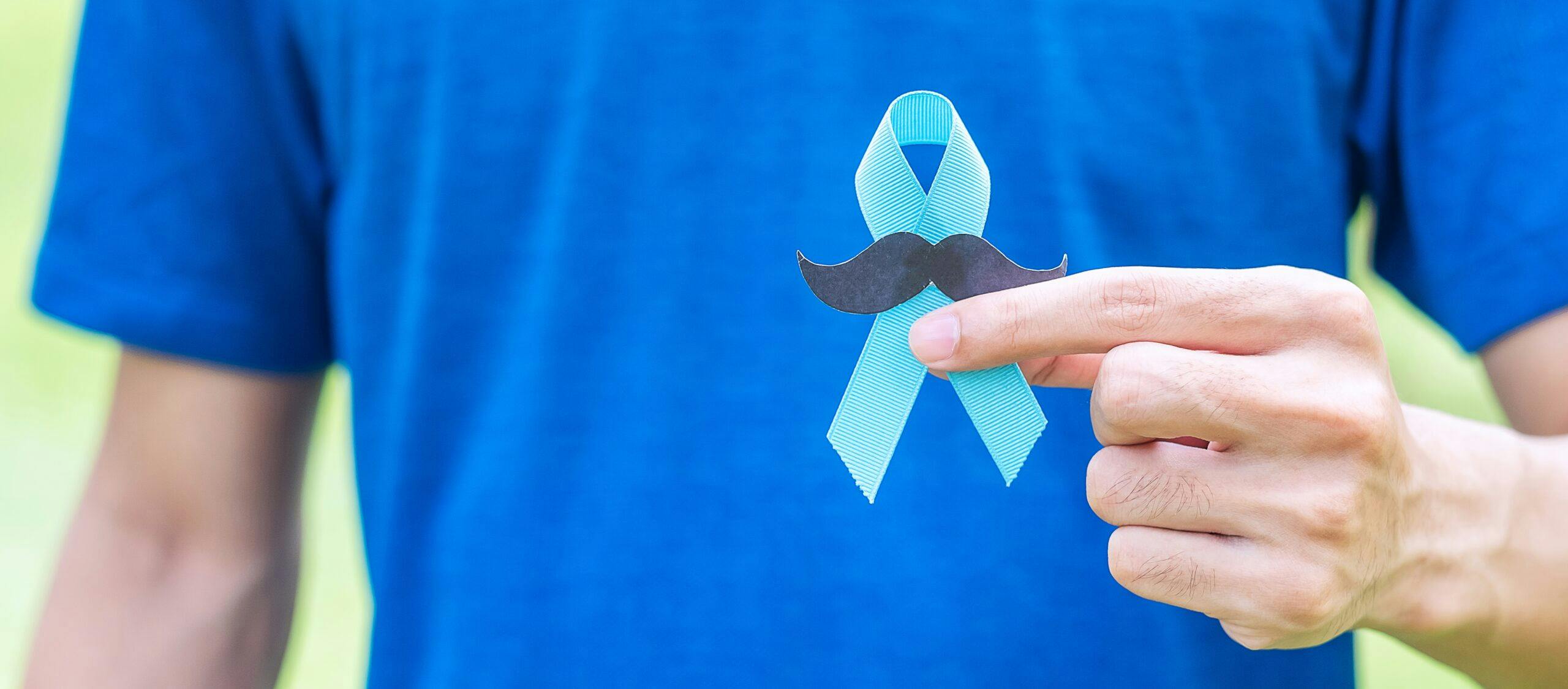 November Prostate Cancer Awareness month, adult Man holding Blue