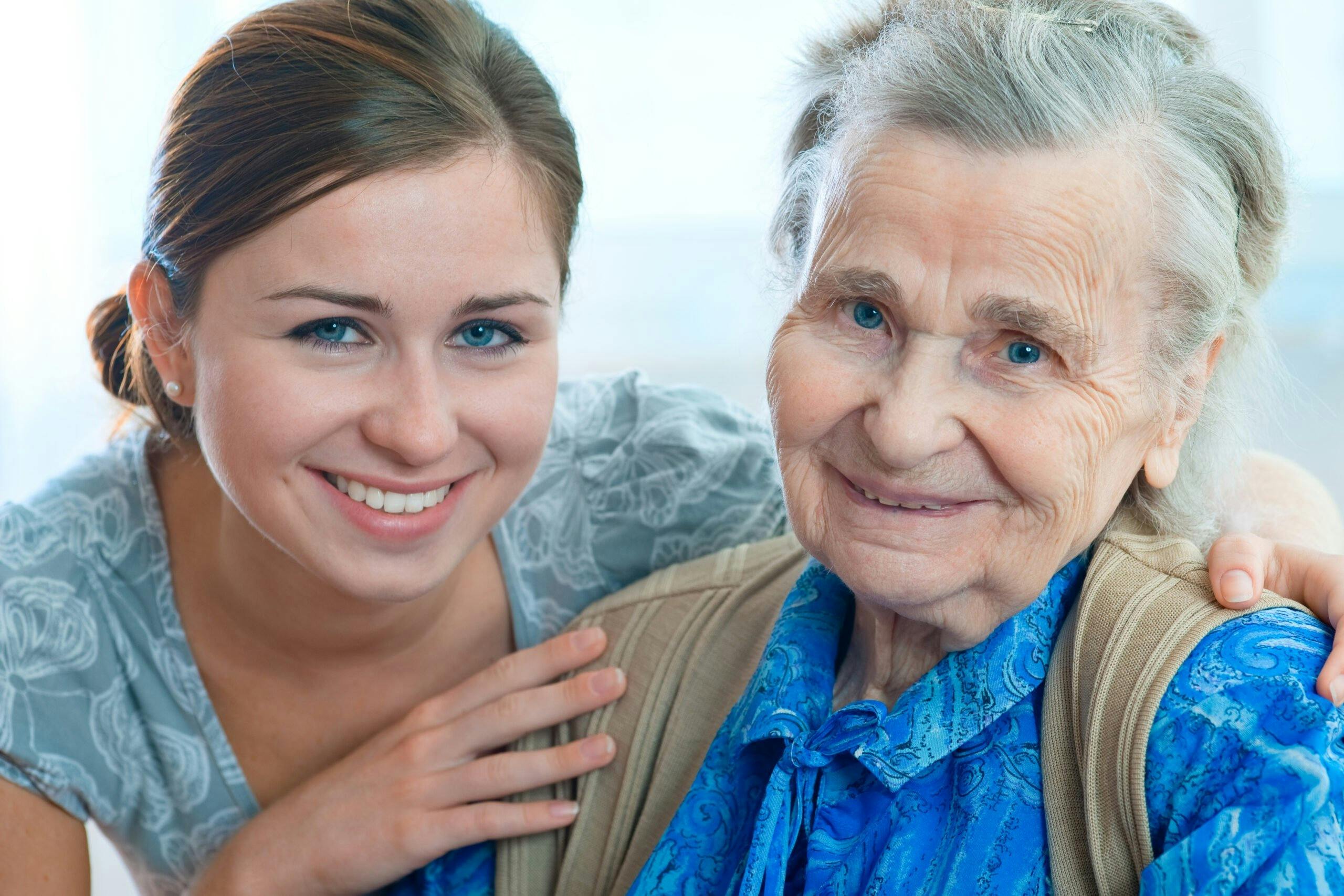 Senior woman with her home caregiver