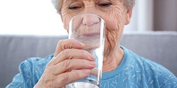 elderly-woman-drinking-glass-of-water