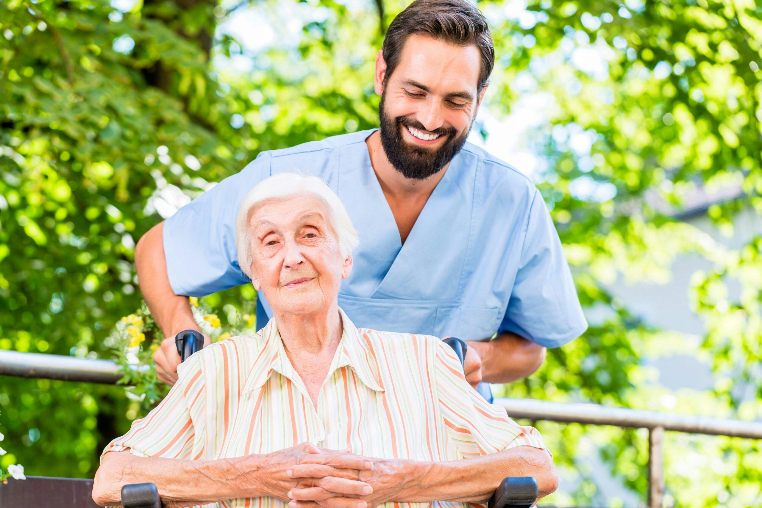 Geriatric nurse giving senior woman massage