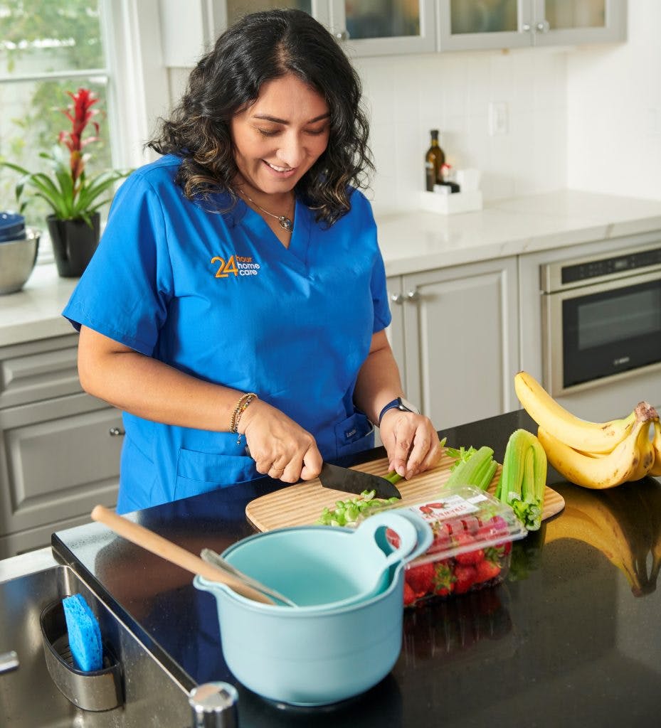 24 Hour Home Care Caregiver Preparing Food
