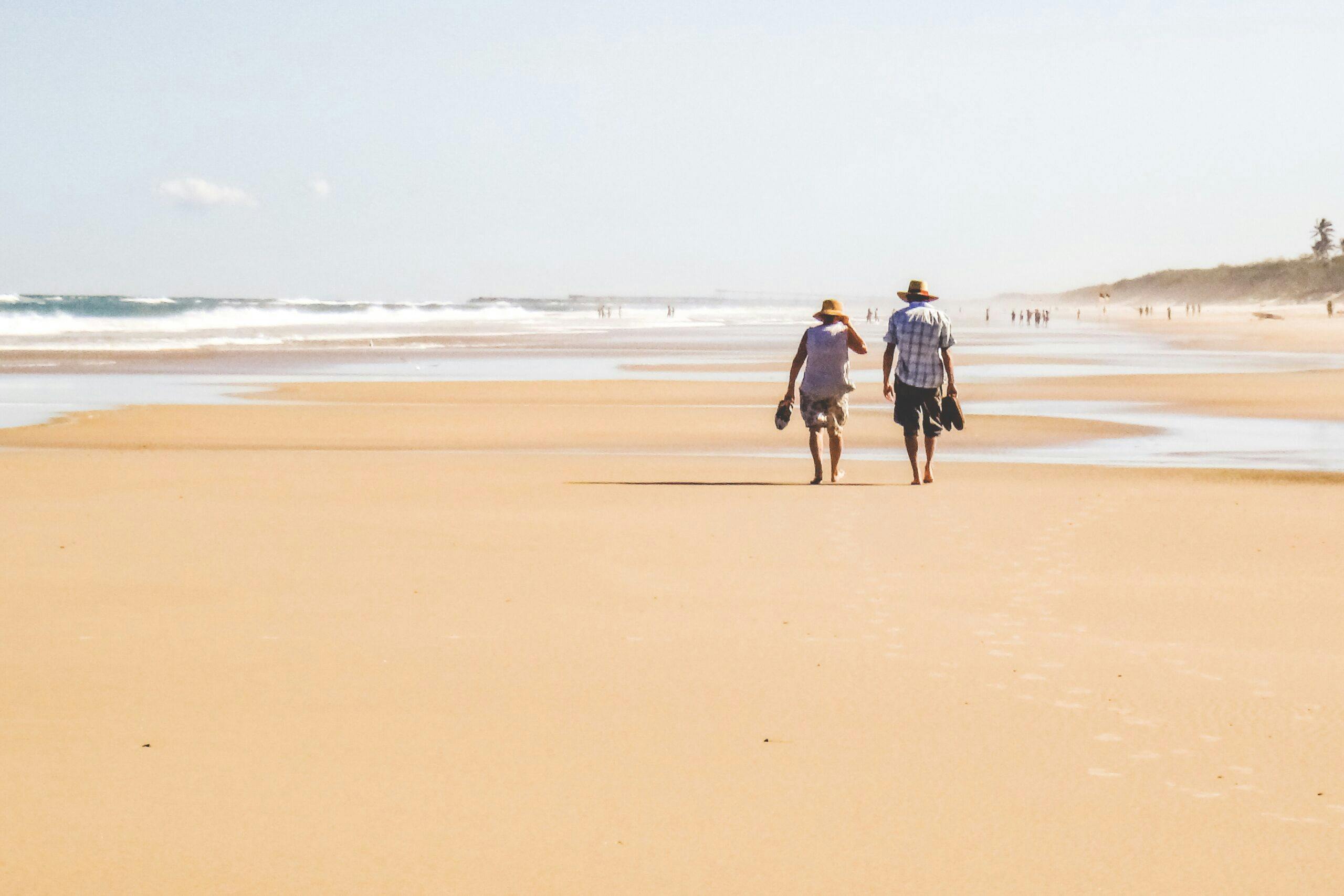 Seniors Walking on Beach