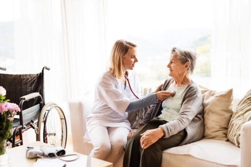 Nurse Taking Senior's Heart Vitals