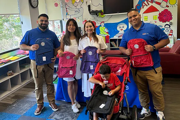 24 Hour Home Care meets with a Southern California family to provide them with a backpack for their son at one of the local Wishpack events.