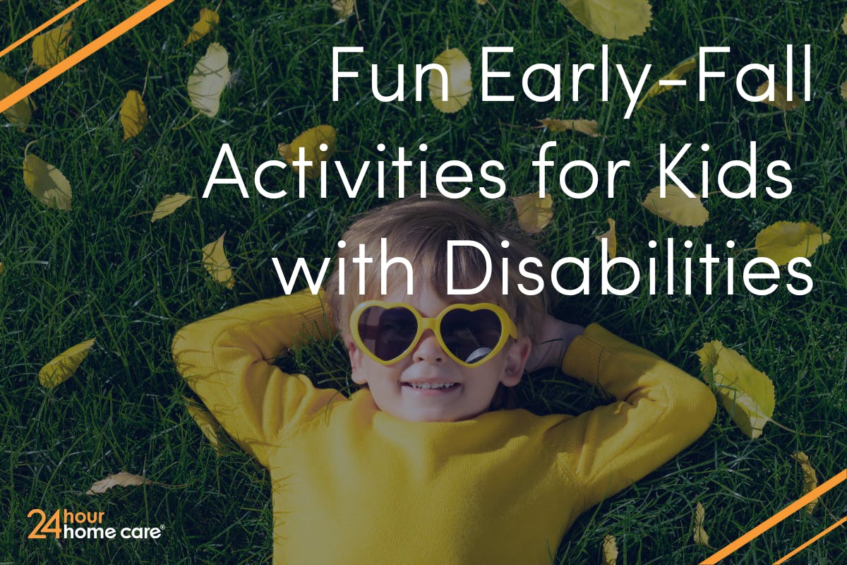Image: A child wears sunglasses and lays in the grass and fallen leaves.