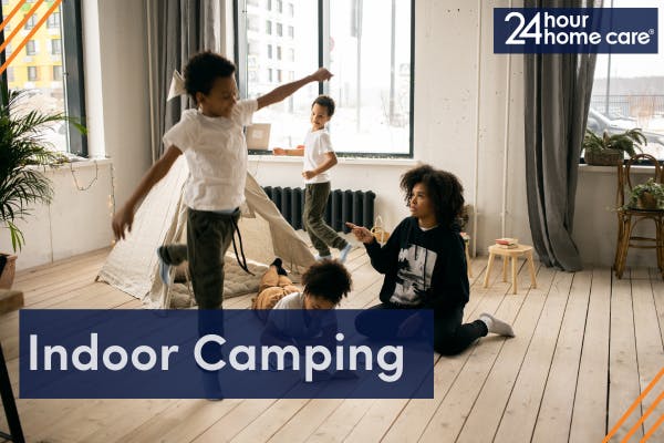 Image: a family having an indoor camping session.