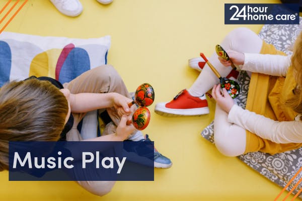 Image: Two children playing with maracas.