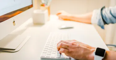 Hands on computer to write a follow up email