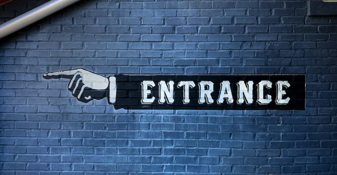 entrance sign representing new hires employee onboarding
