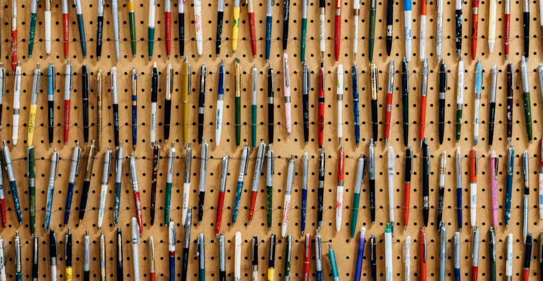 wall of pens representing learning content management system