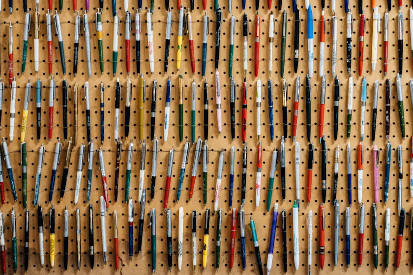 wall of pens representing learning content management system