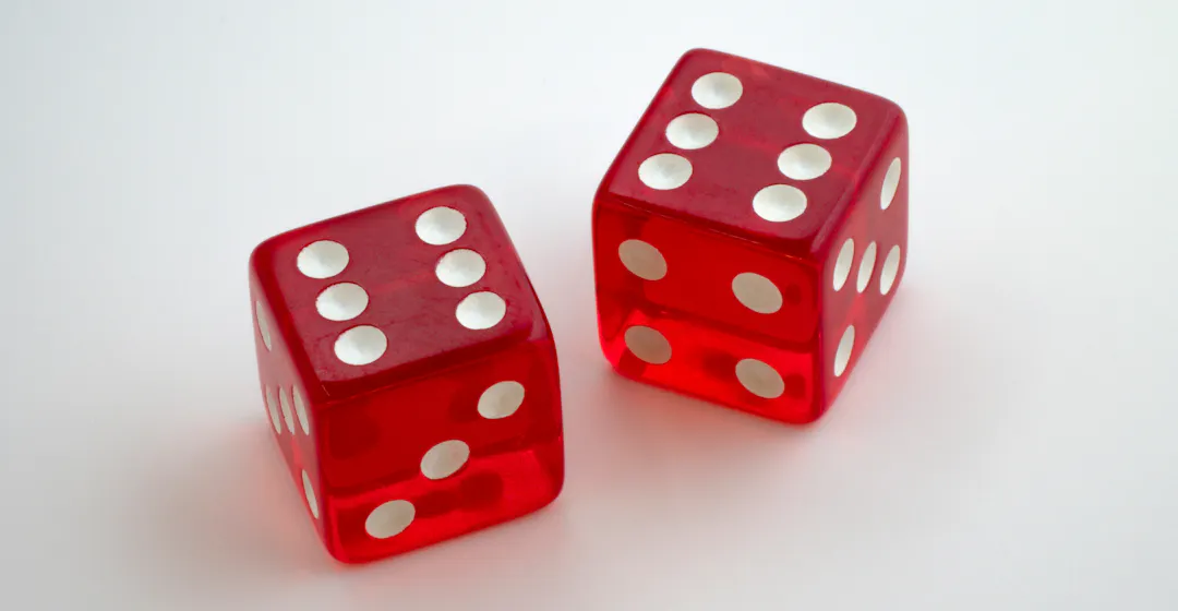 Double-six rolled on red dice representing the twelve best learning and development tools in 2024.