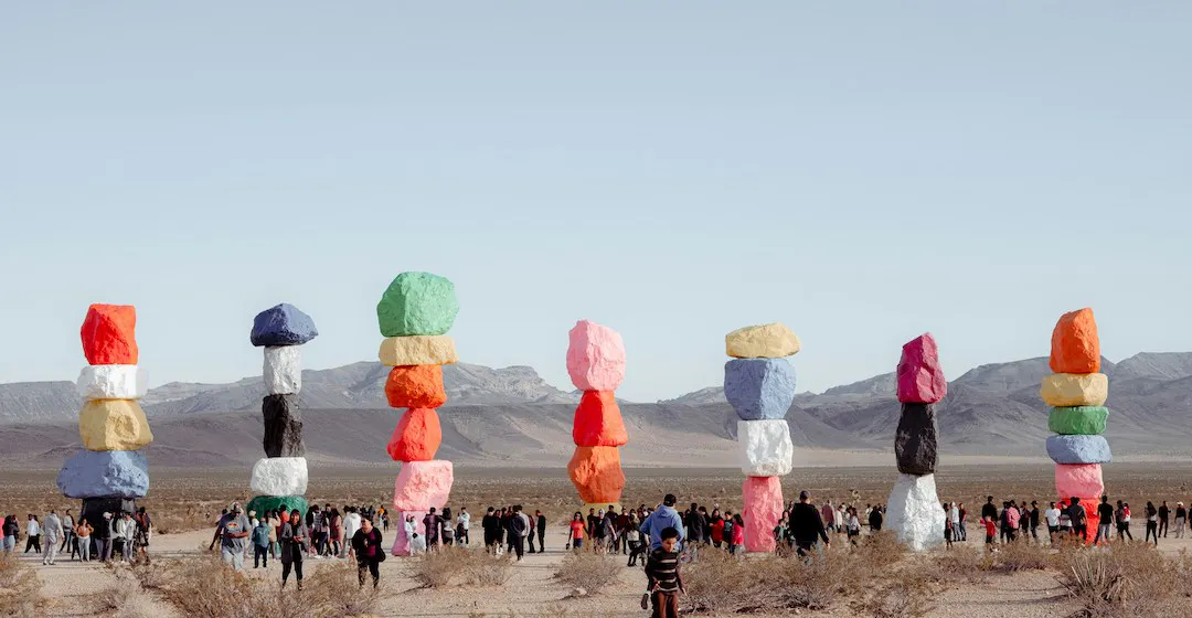 Seven colored stone pillars representing the best employee onboarding learning management systems of 2025