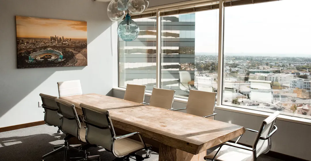 Boardroom table representing Comcast's learning council