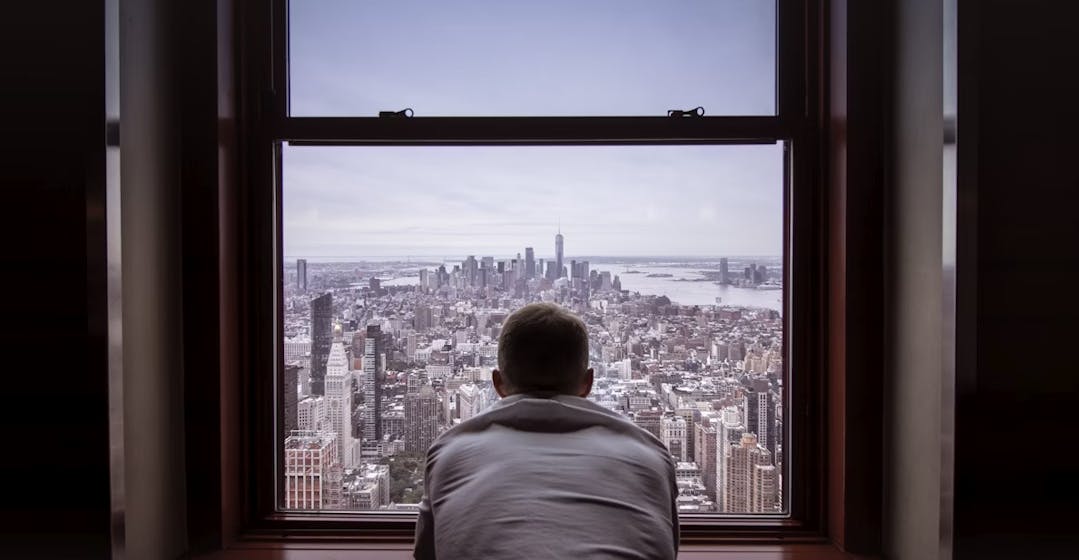 Enterprise skills unlocked, man looking over New York City