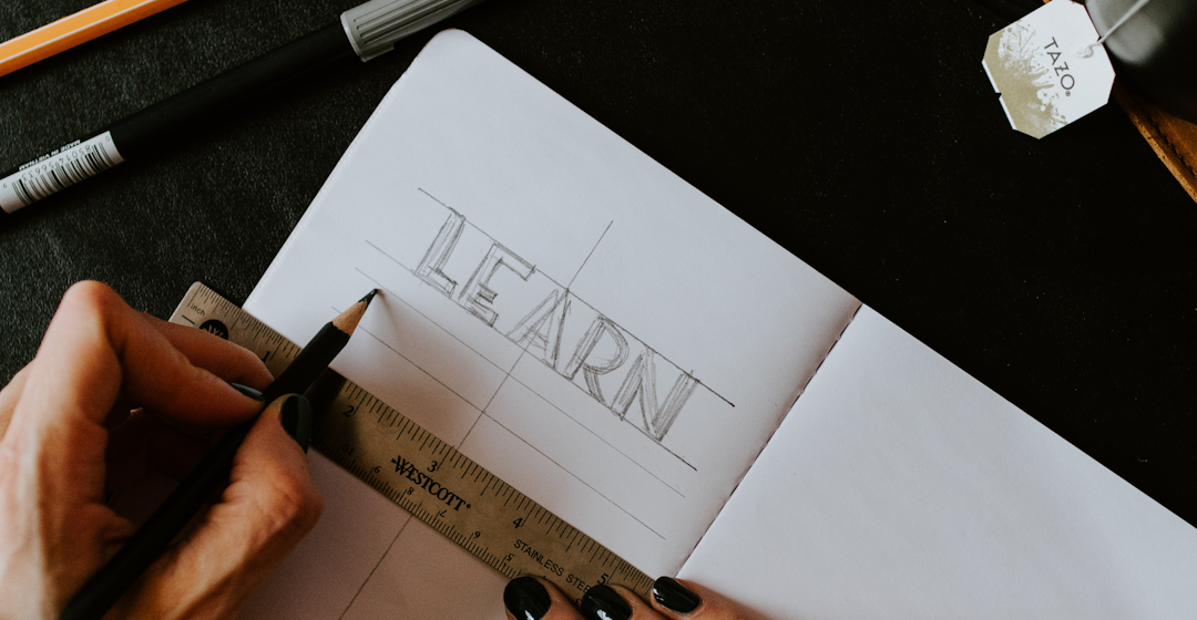 woman writing the word learn representing the customer onboarding process