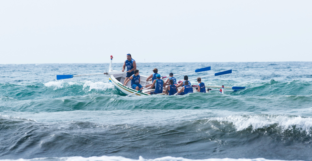 Men in boat representing management coaching