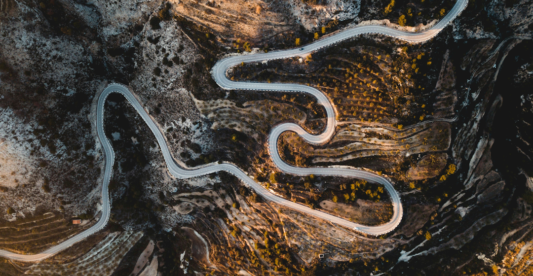 Winding road representing the complex but rewarding L&D leadership journey