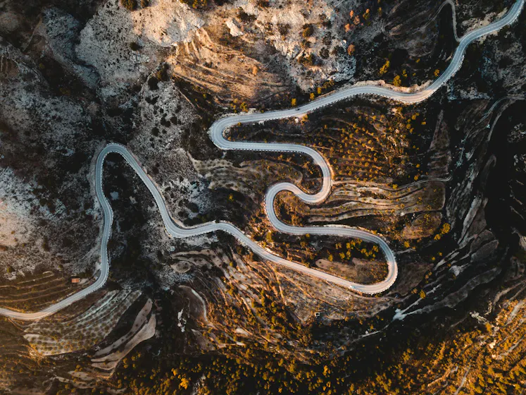Winding road representing the complex but rewarding L&D leadership journey