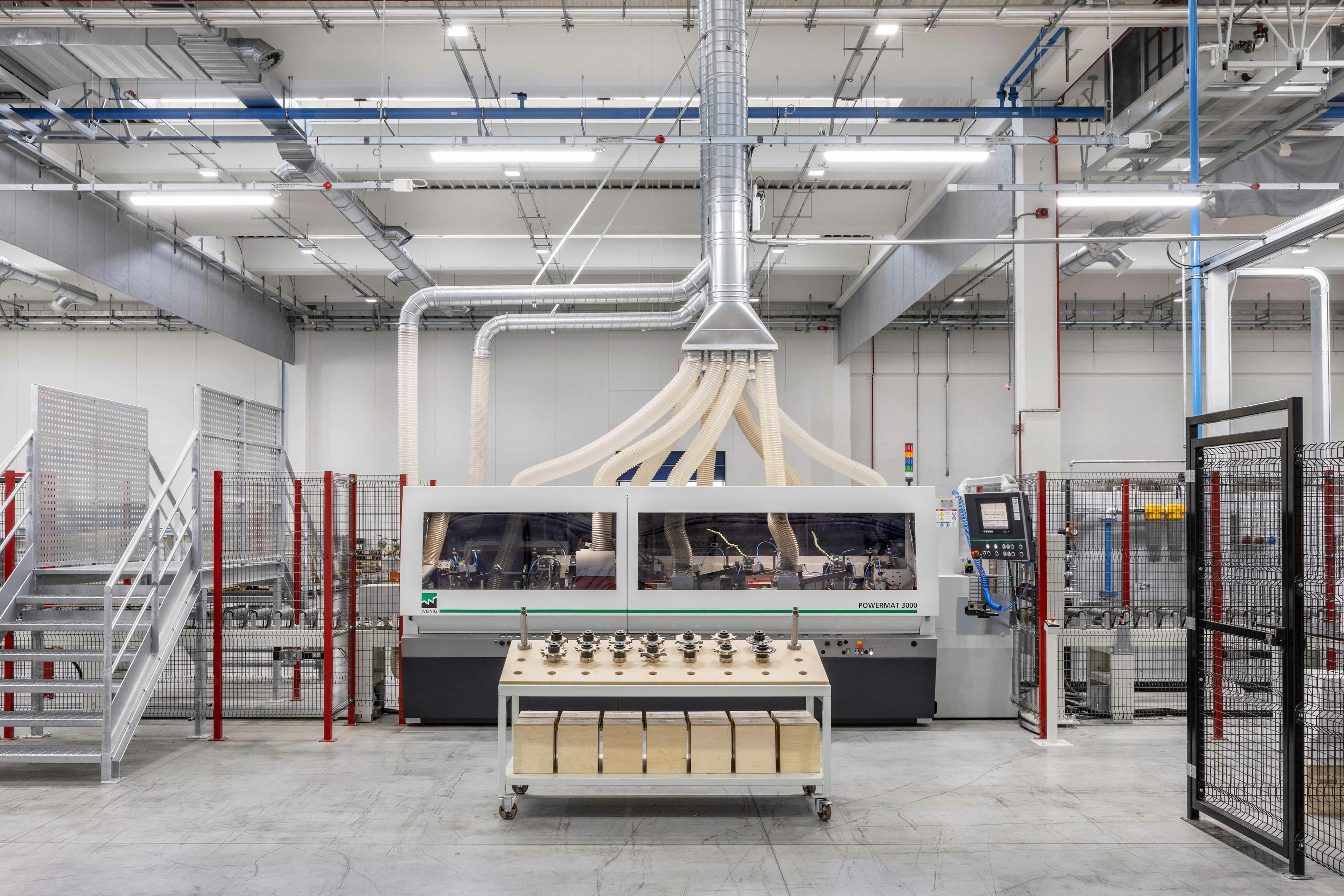Interior of 3B factory with industrial machinery viewed from the front
