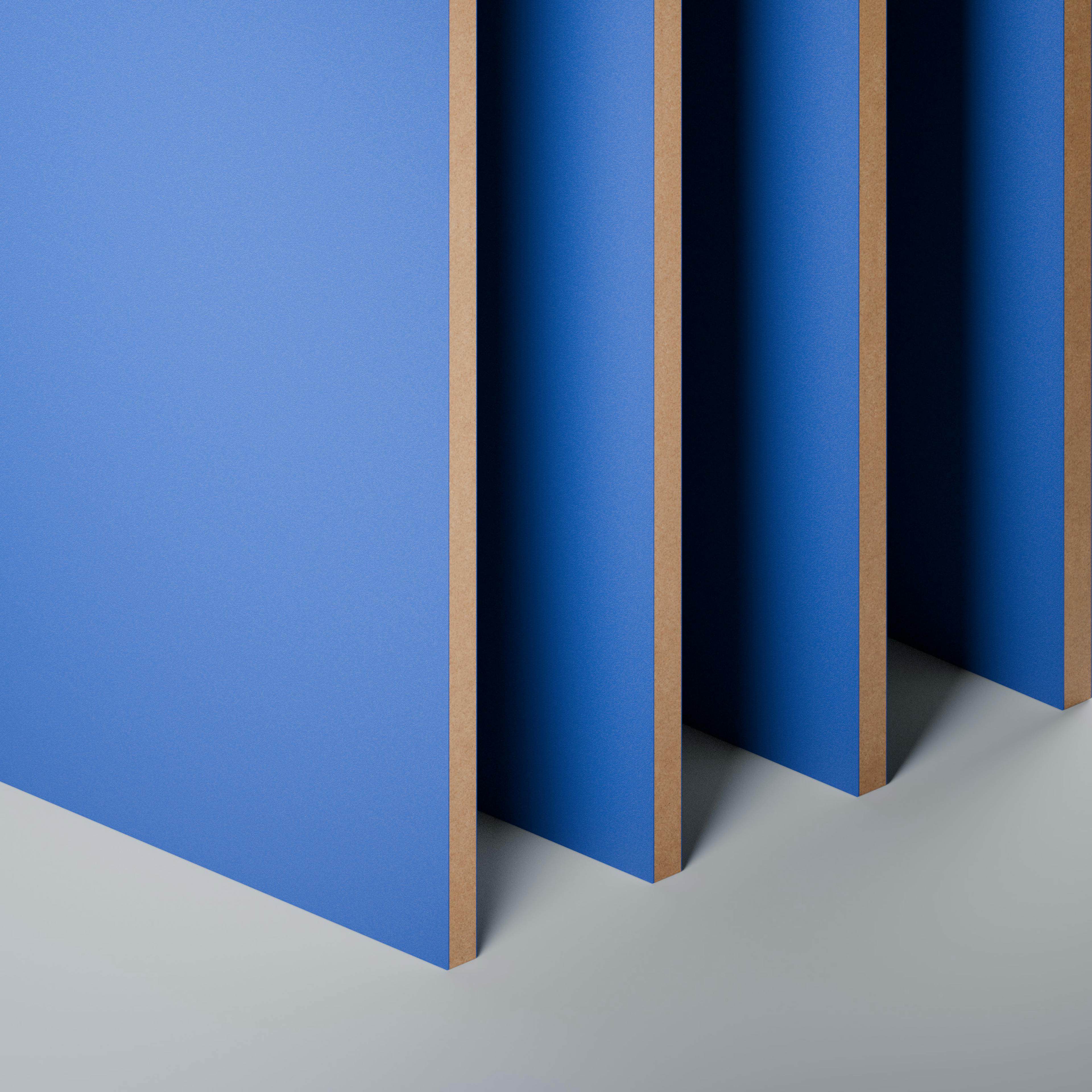 Close-up view of bright blue, uniform panels. Arranged in a row and neatly aligned.