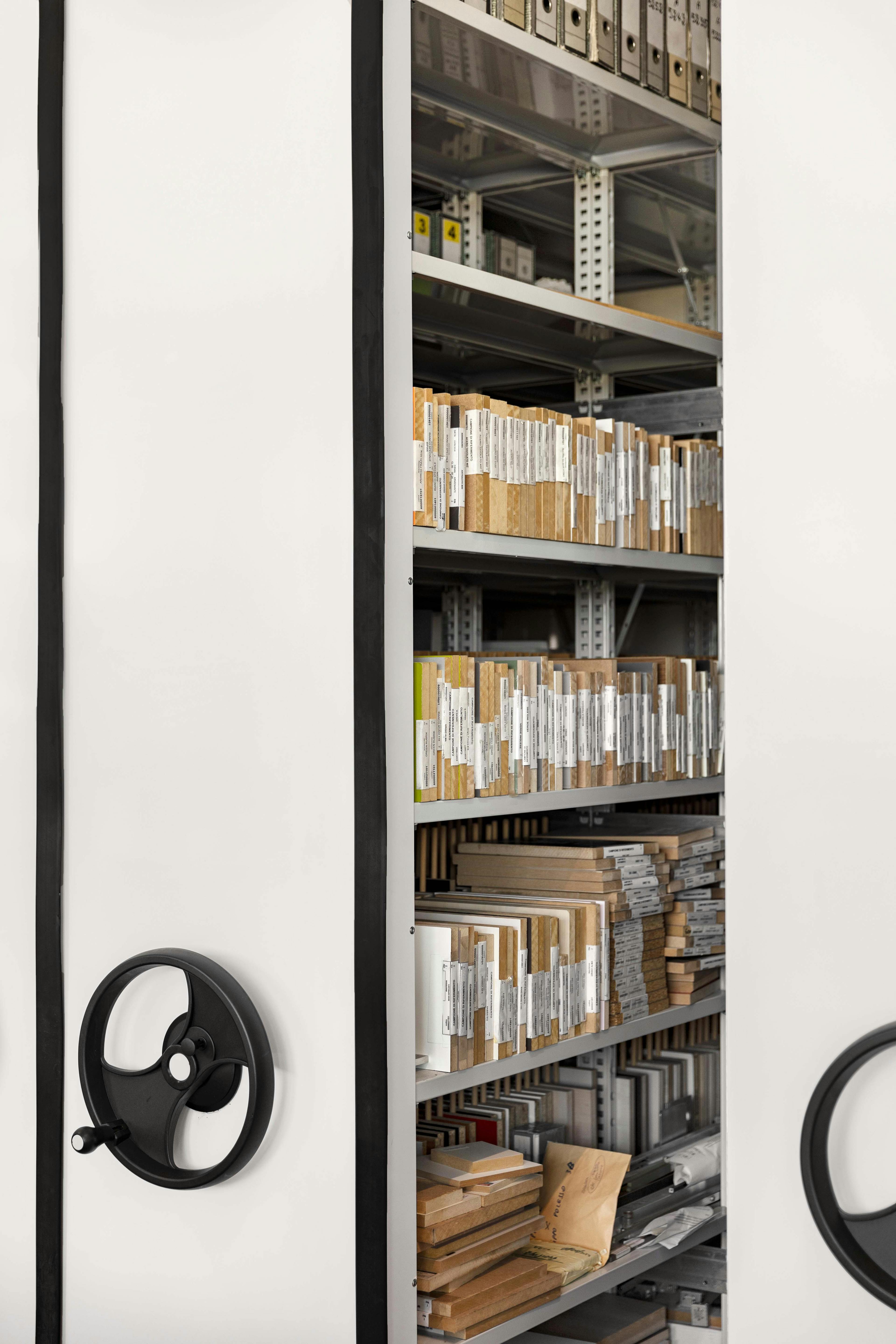 View of the archive section of the laboratory with shelves holding numerous wooden containers and documents.