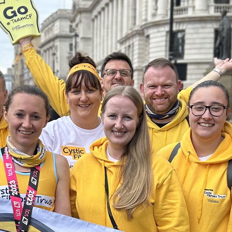 Group of smiling fundraisers in Cystic Fibrosis Trust gear