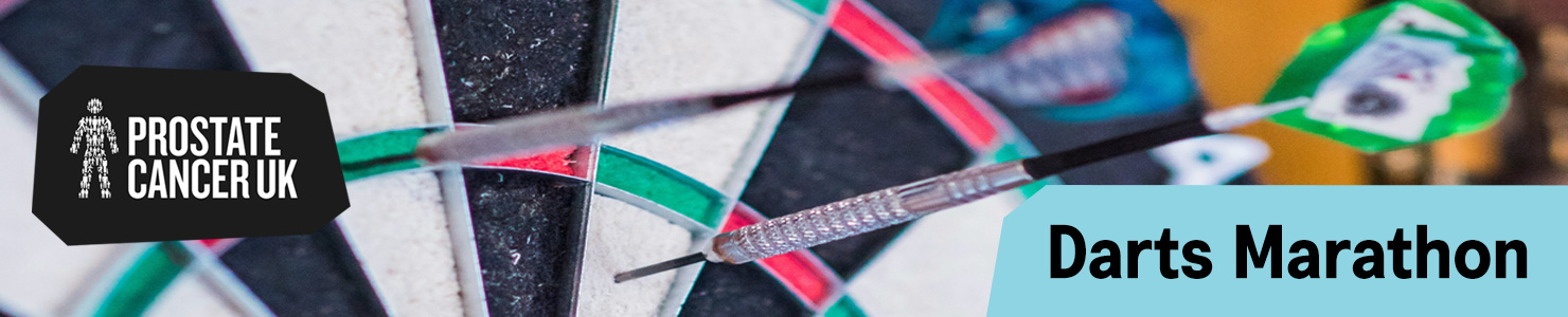 Darts embedded in a dartboard promoting Prostate Cancer UK’s Darts Marathon challenge.