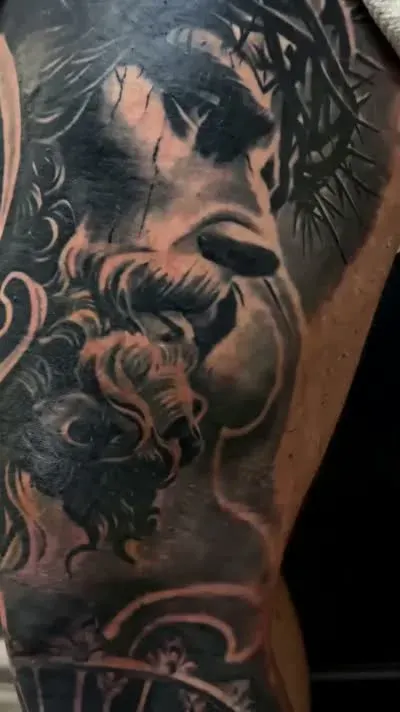 Black-and-grey portrait detail from a published leg-piece video