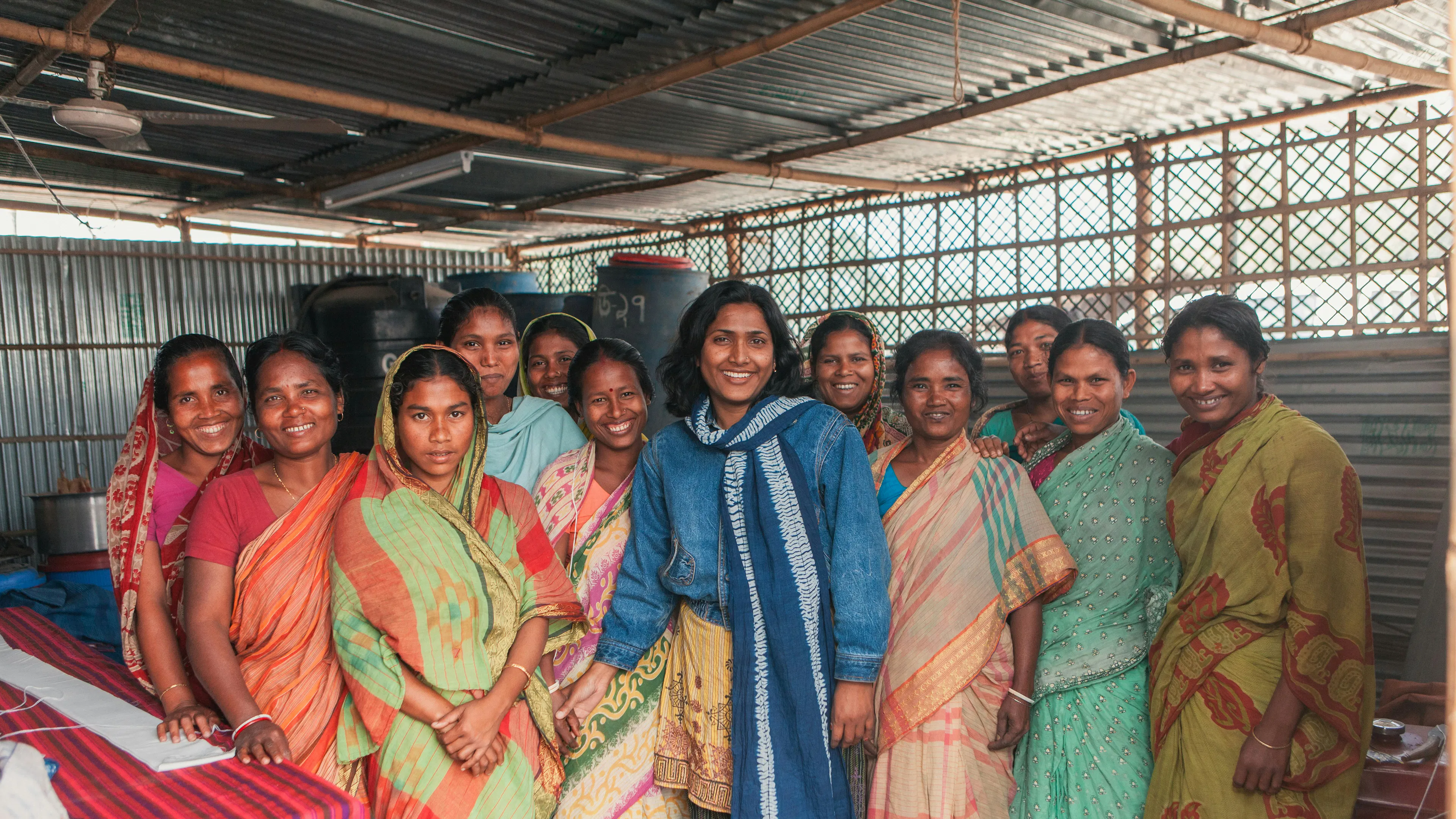 Women standing together at a community programme