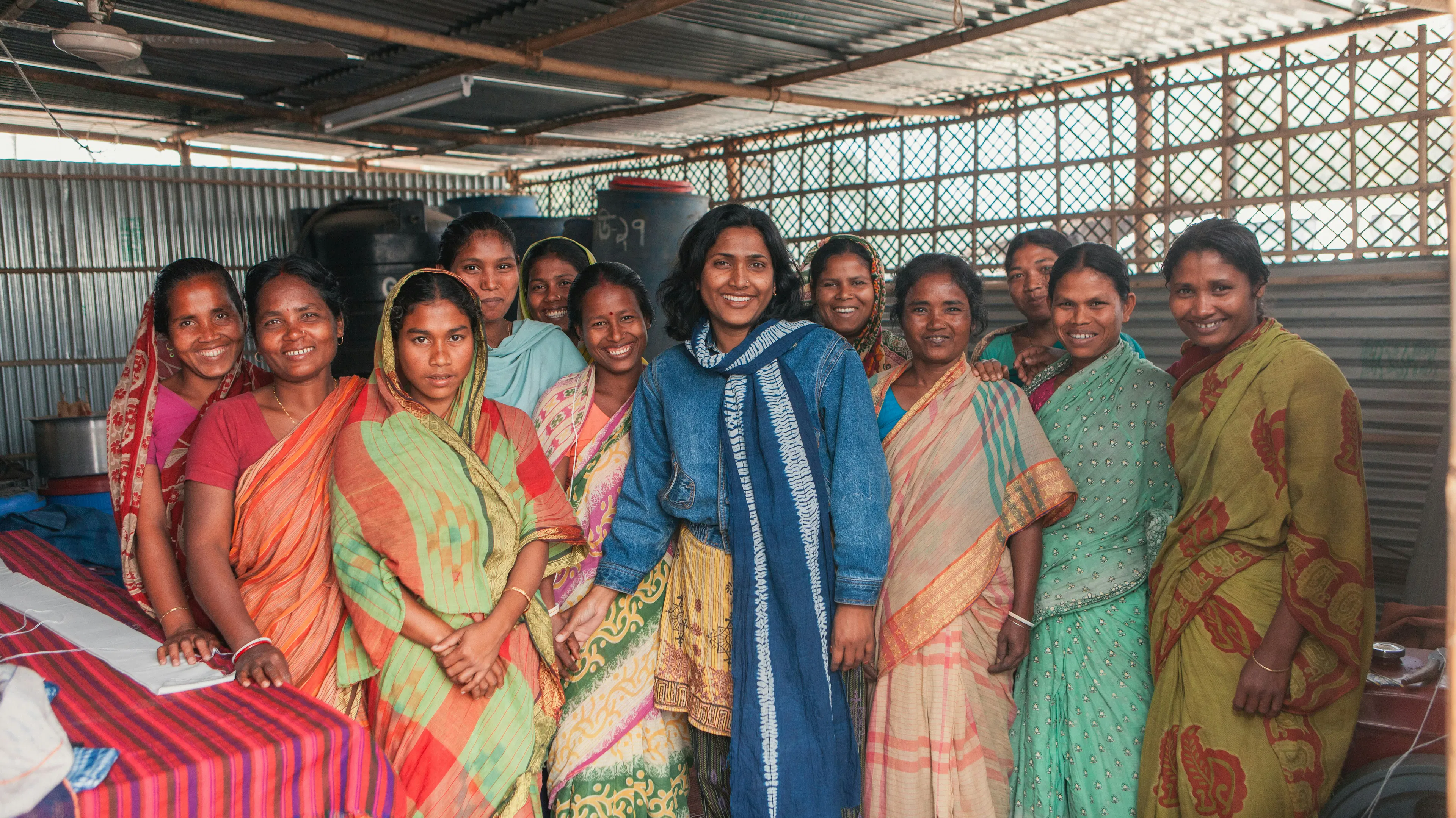 Women standing together at a community programme