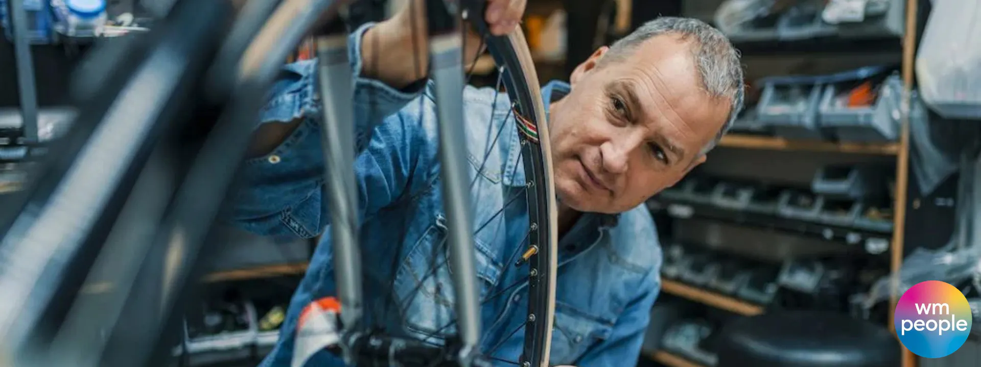 older male working on a bicycle