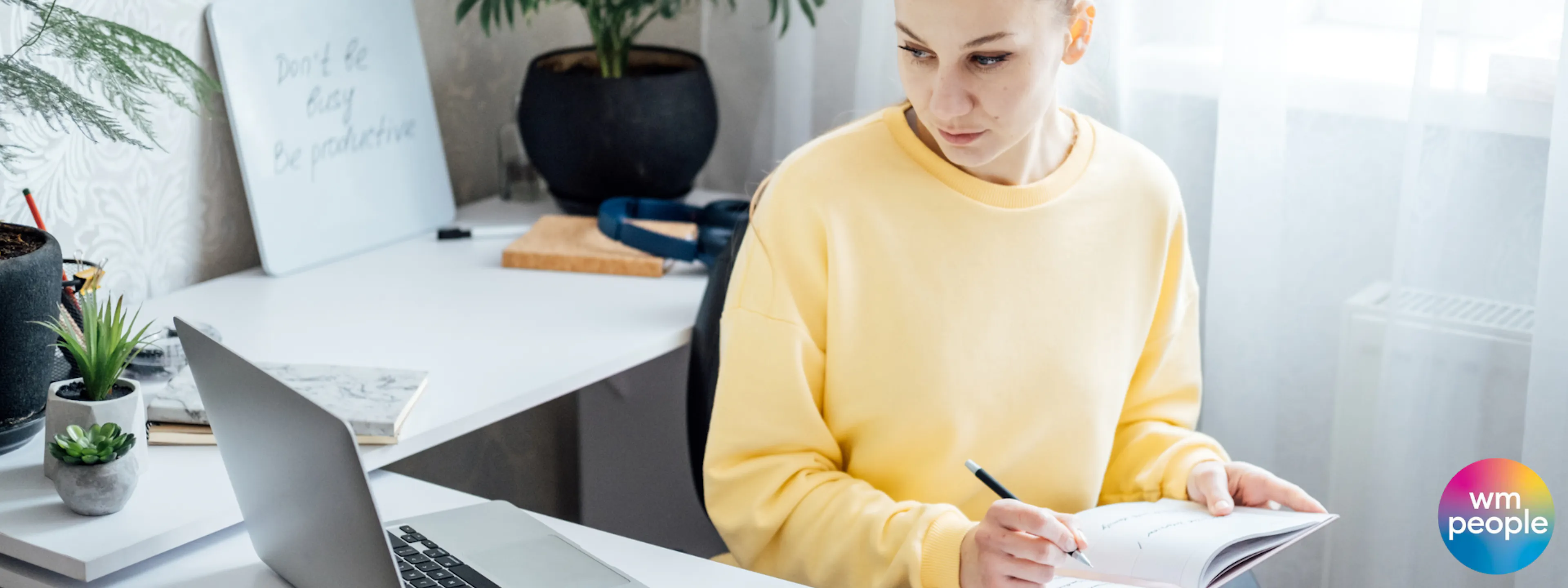 female at desk looking at computer