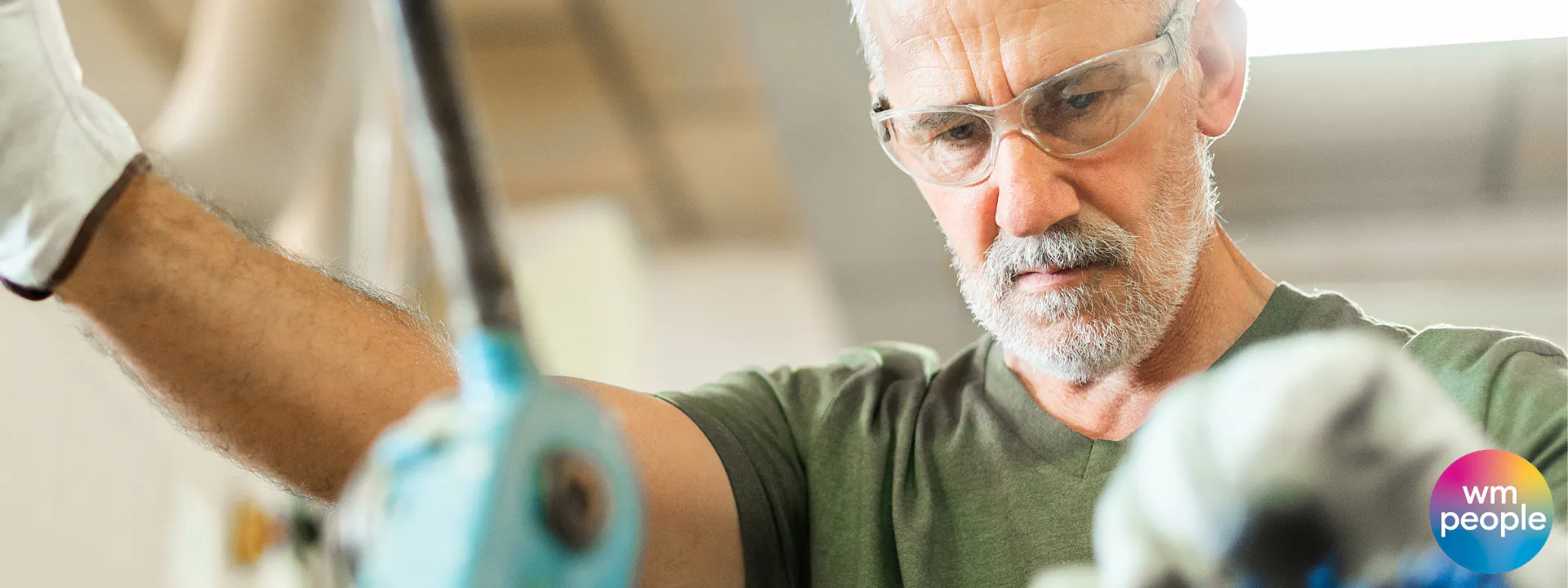 older male skilled worker on tools