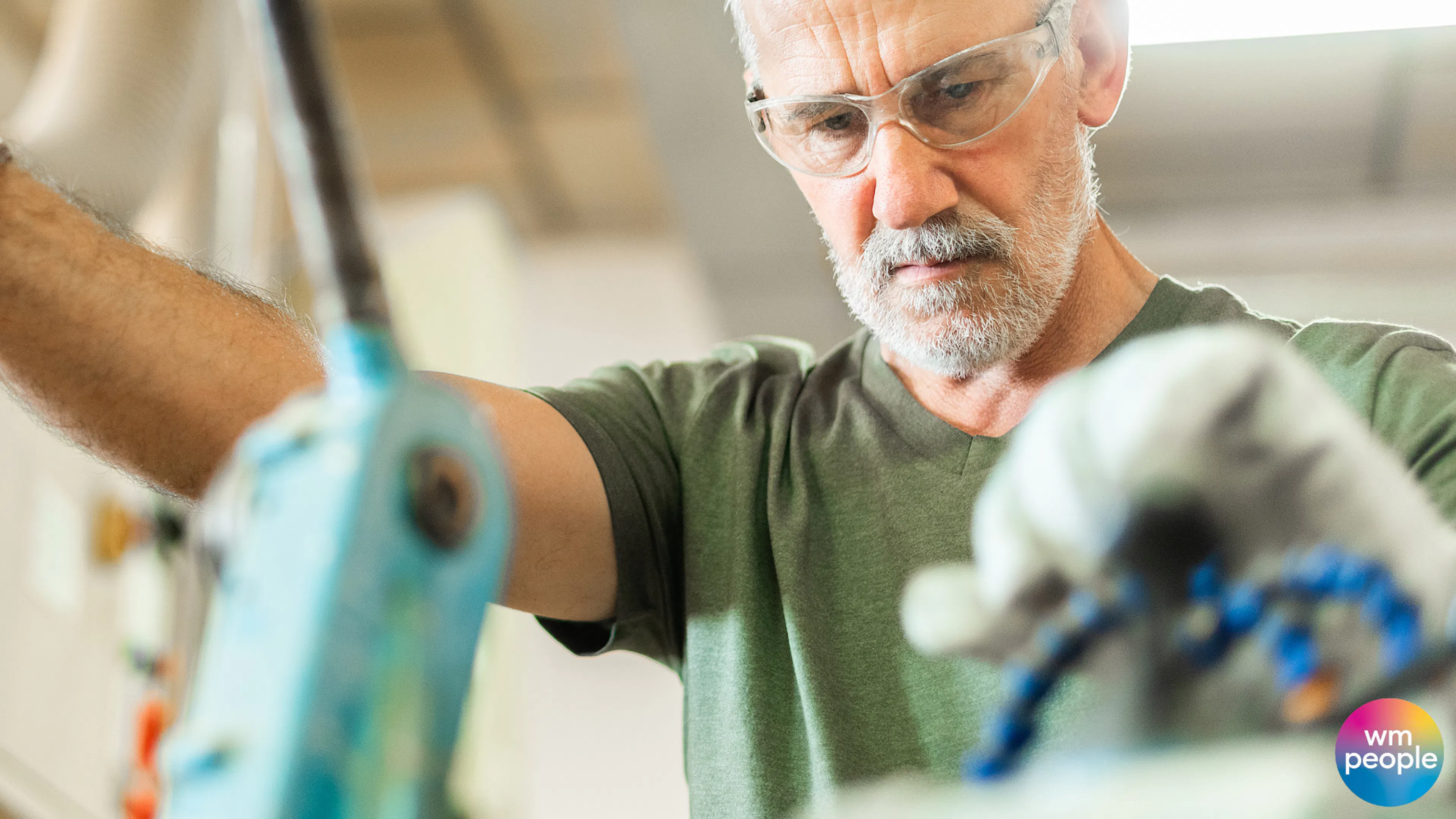older male skilled worker on tools 
