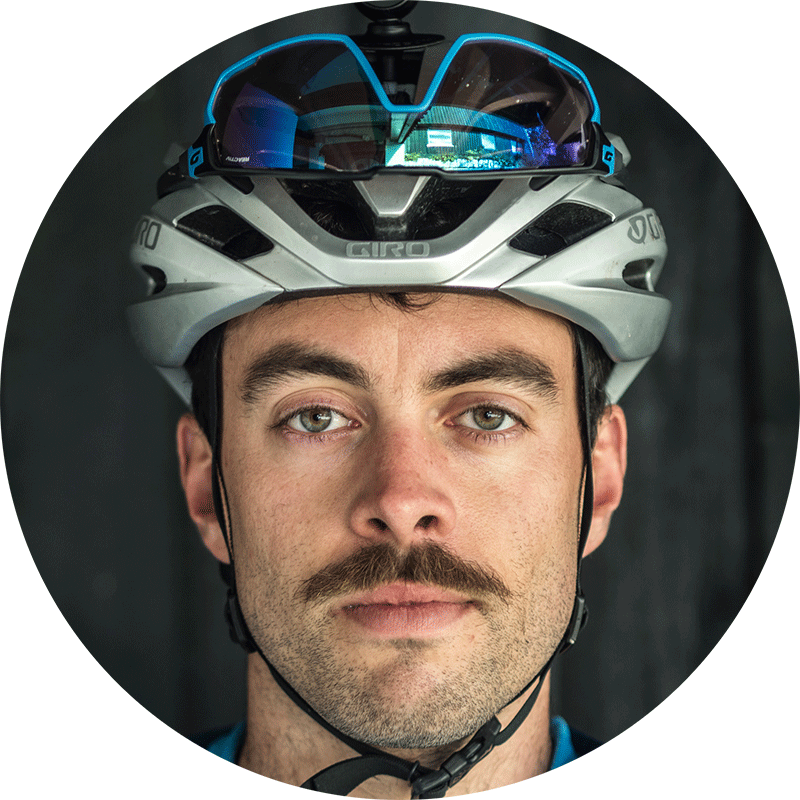 Huw Oliver in a white helmet with sunglasses pushed up on the brow
