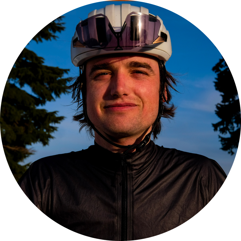 Portrait of Stef Curtis in a helmet against a dusk sky