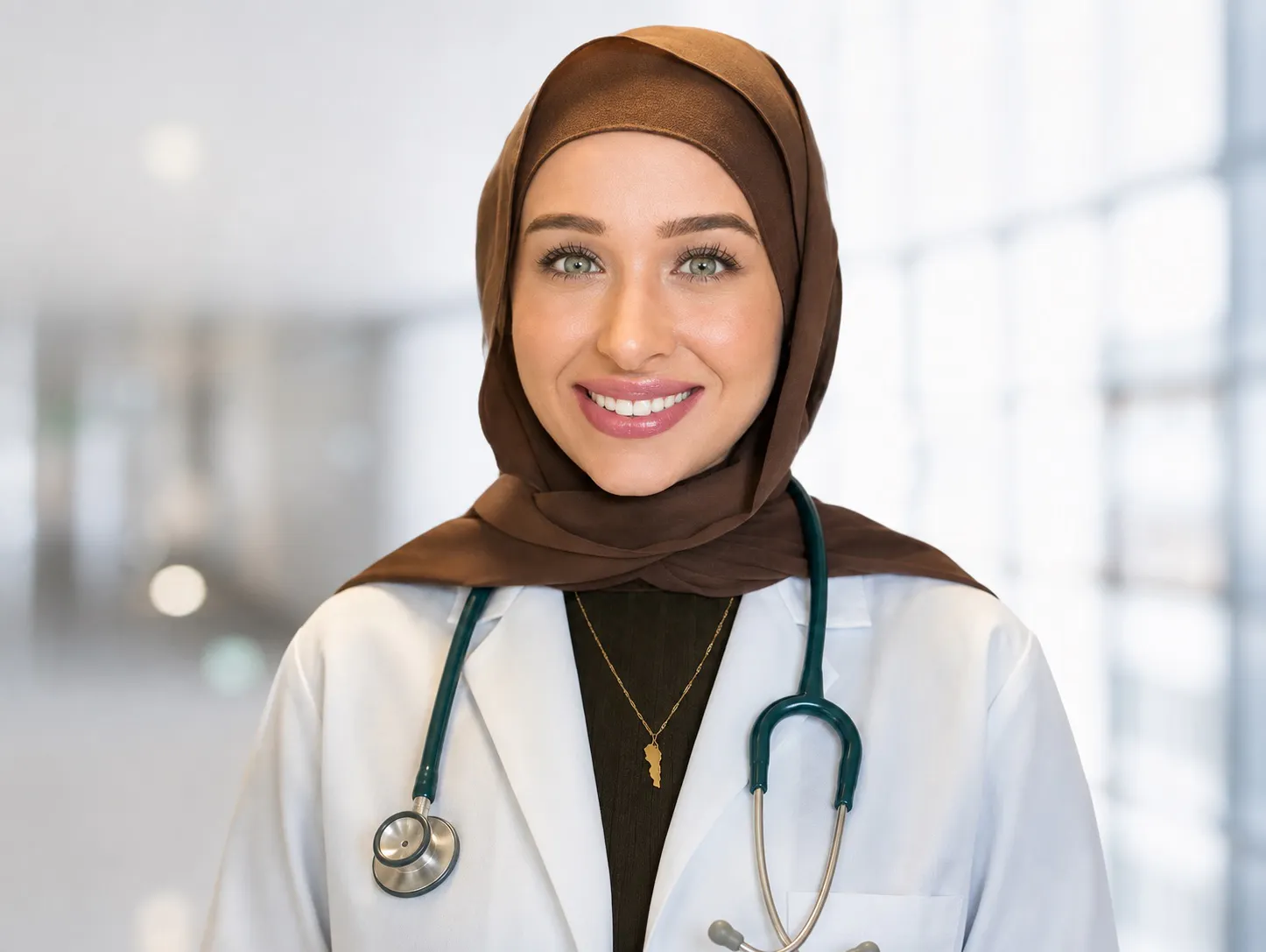 Dr. Nadine Kamel Jawad smiling in a professional portrait