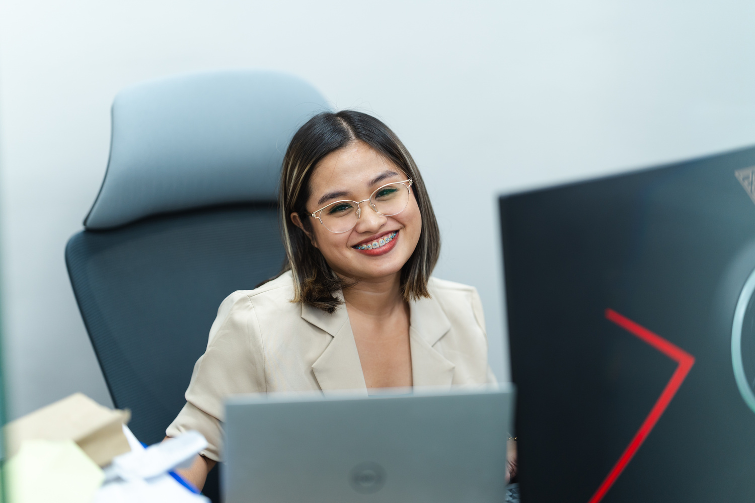 A CC.Talent virtual assistant in the Philippines working at a desk with a headset and laptop