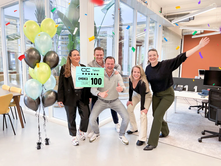 The CC.Talent Netherlands team celebrating their Emerce 100 listing in the Weesp office