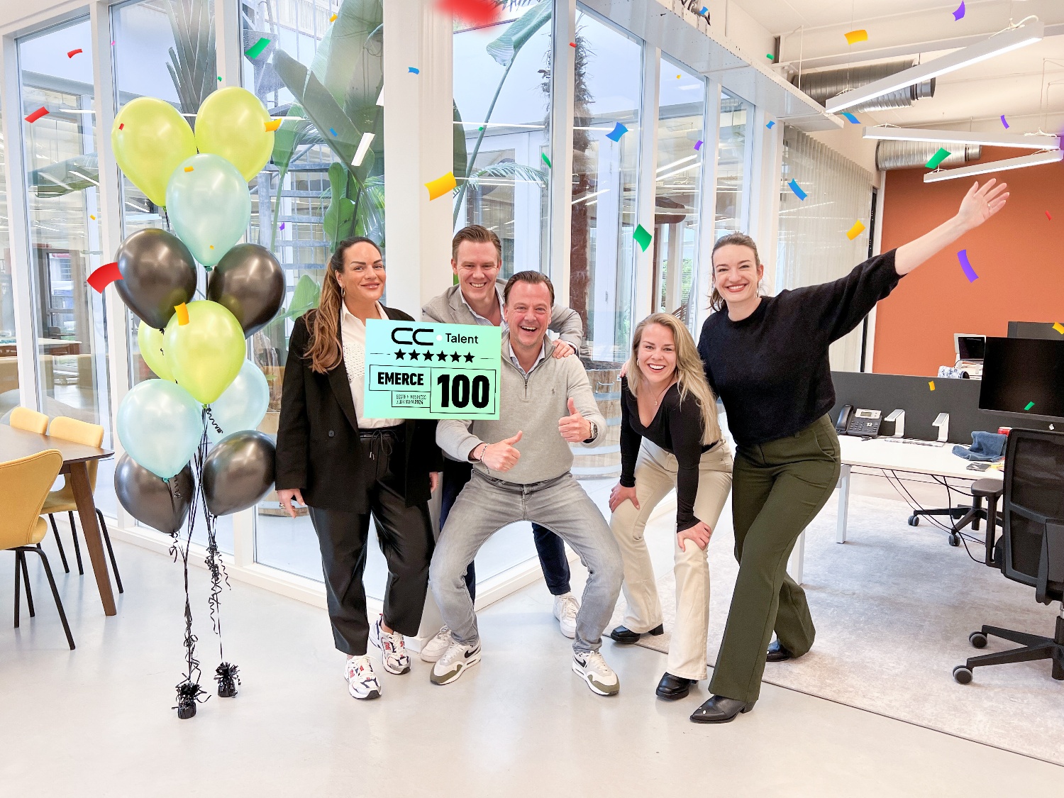The CC.Talent Netherlands team celebrating their Emerce 100 listing in the Weesp office