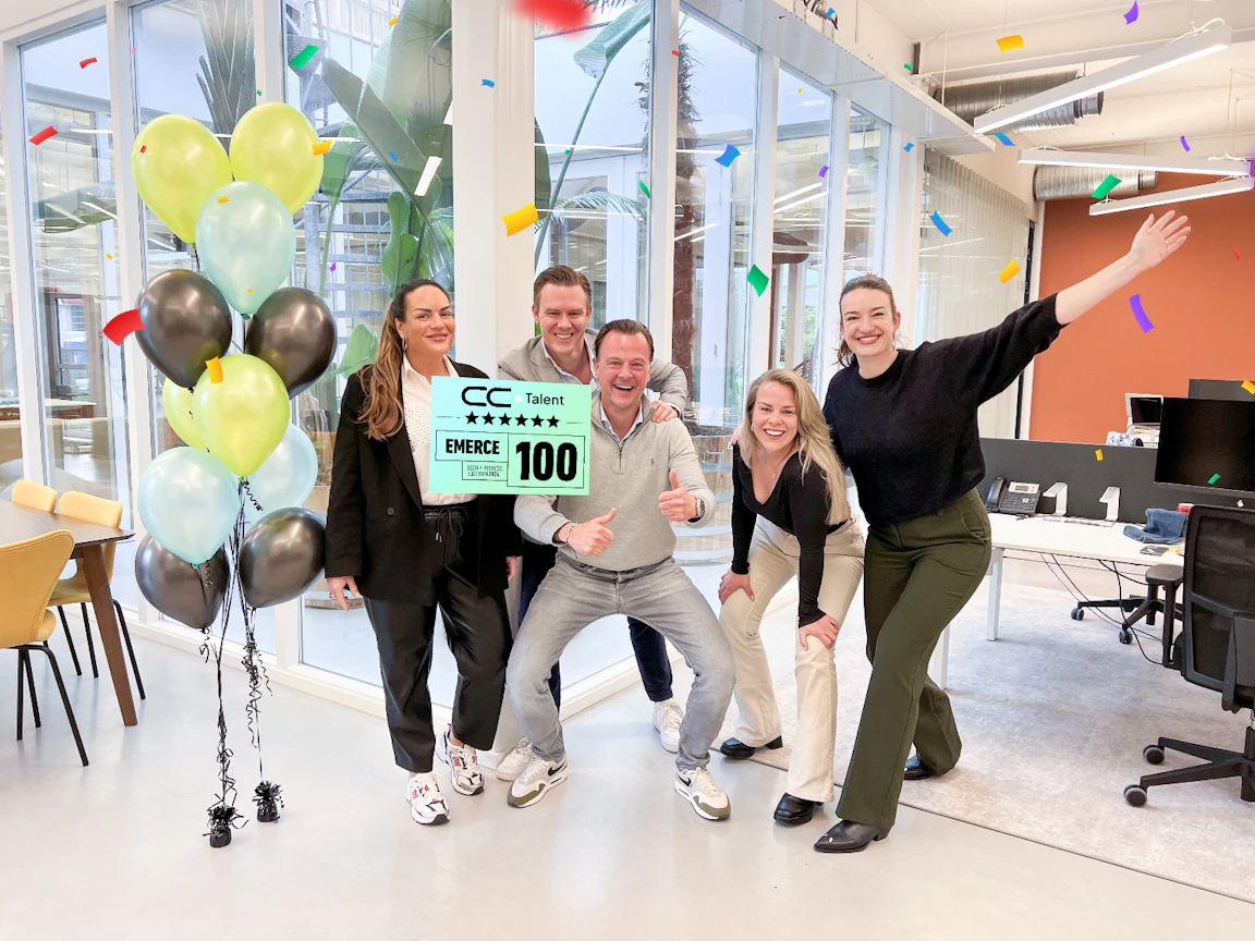 The CC.Talent Netherlands team celebrating their Emerce 100 listing in the Weesp office