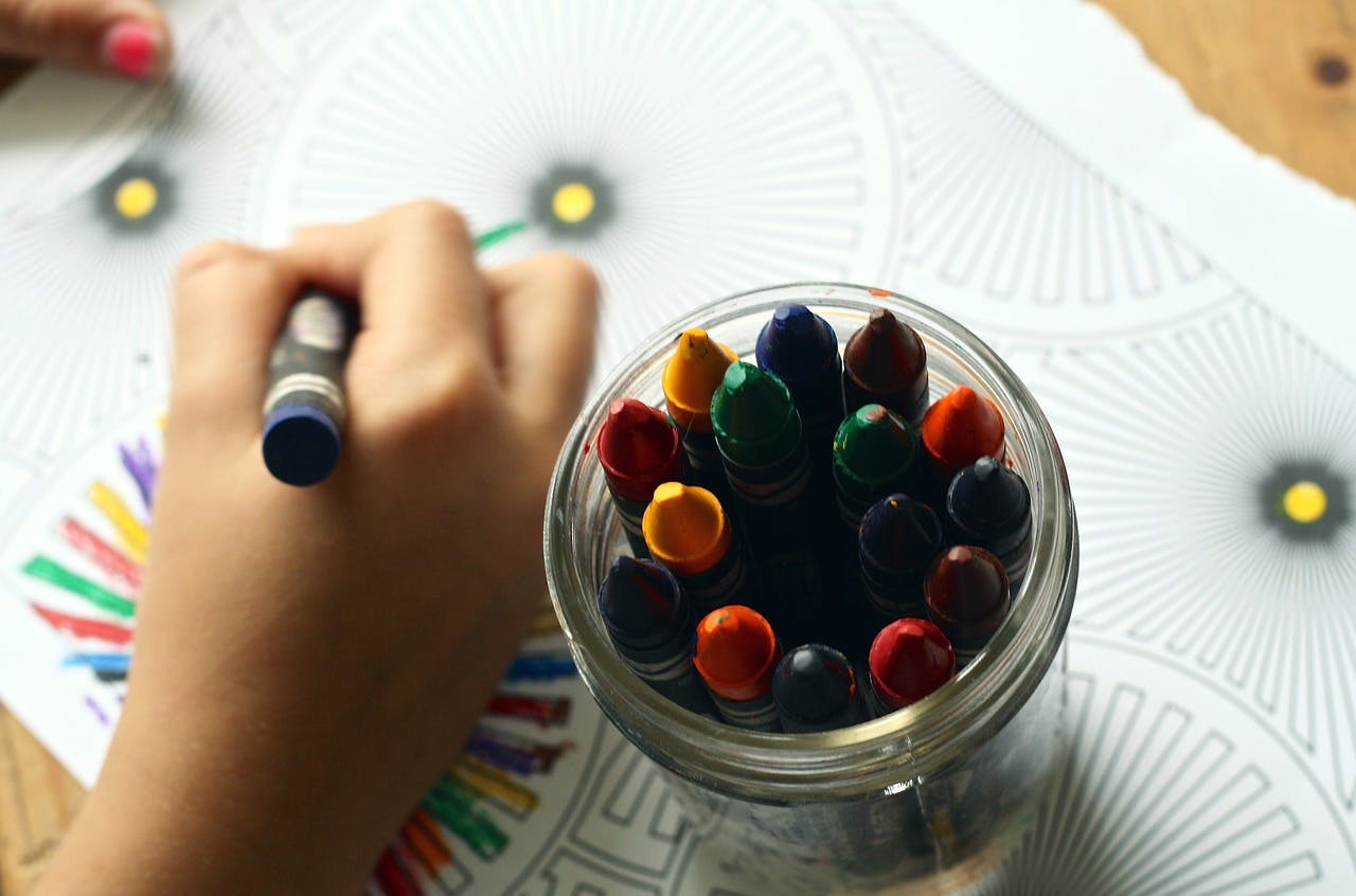 child using crayons