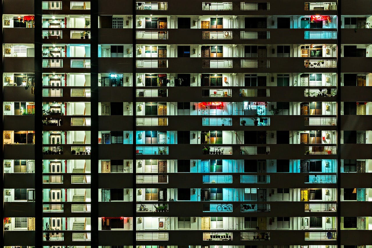 Frontal view of HDB common corridor flats at night